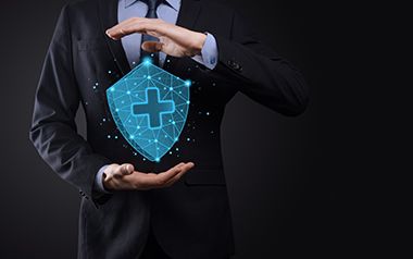 What are the advantages of implementing an employees group insurance scheme in a small business?